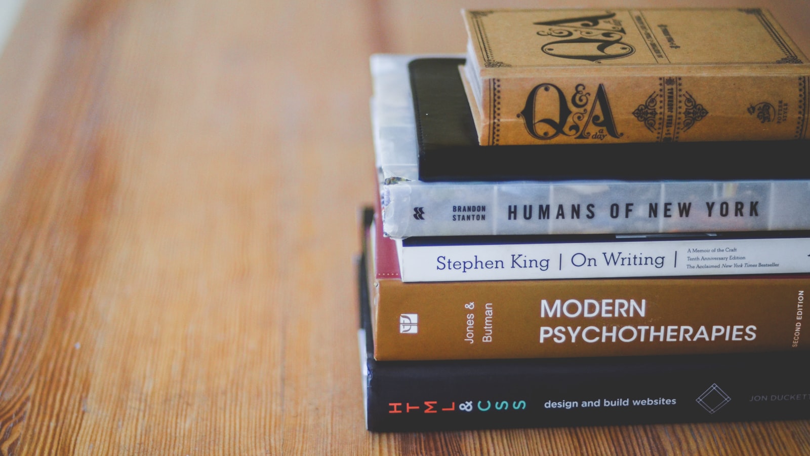 Assorted reading books on table